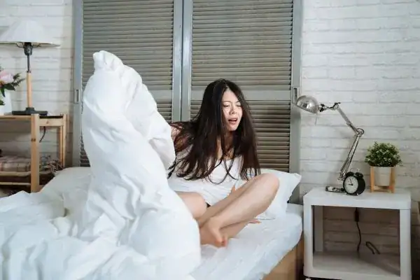 Image of woman getting up because of nighttime leaks Newcastle upon Tyne